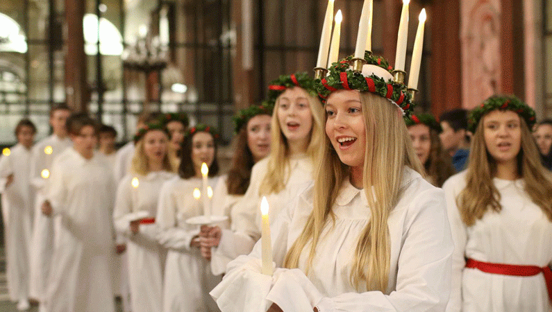 The Ambassador of Poland Arkady Rzegocki leads the carol singing at a festive Polish Christmas party