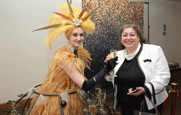 Guests are greeted with some fizz by a Champagne Standing Lady