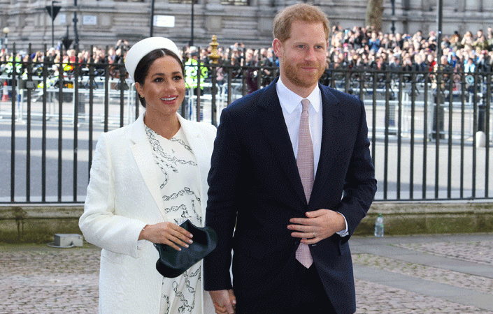 Crowds cheer as the Duke and Duchess of Sussex arrive outside Westminster